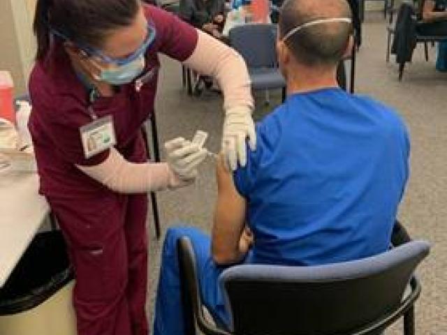 Platt College students administer COVID-19 vaccination
