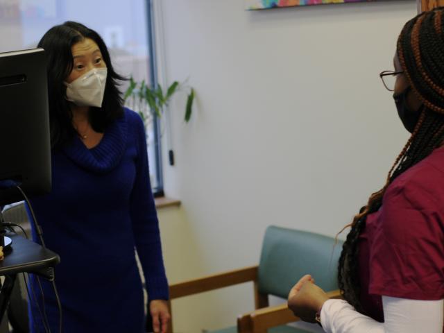 Barb Jones meeting with a student.